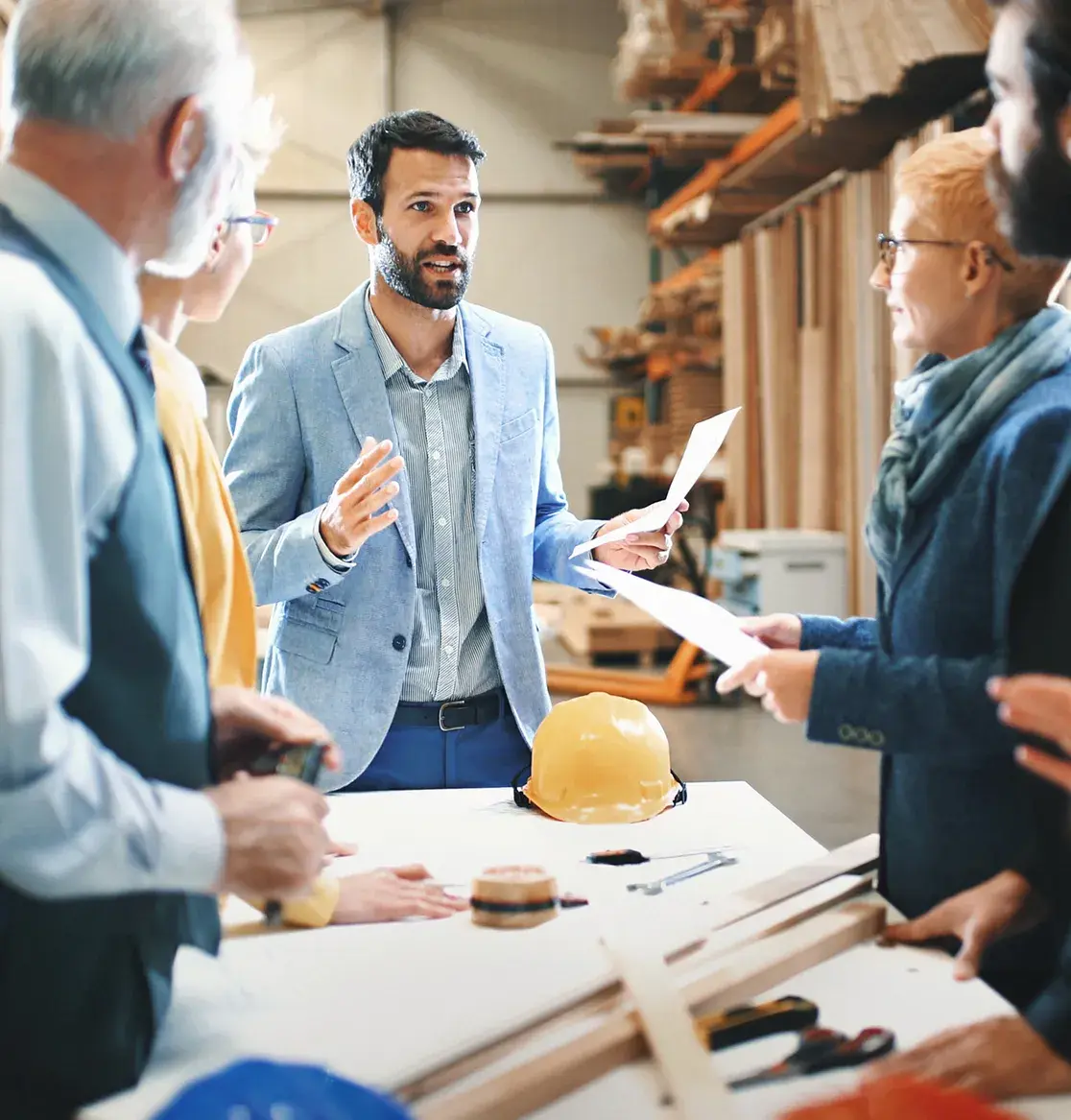 Business leaders conversing in warehouse